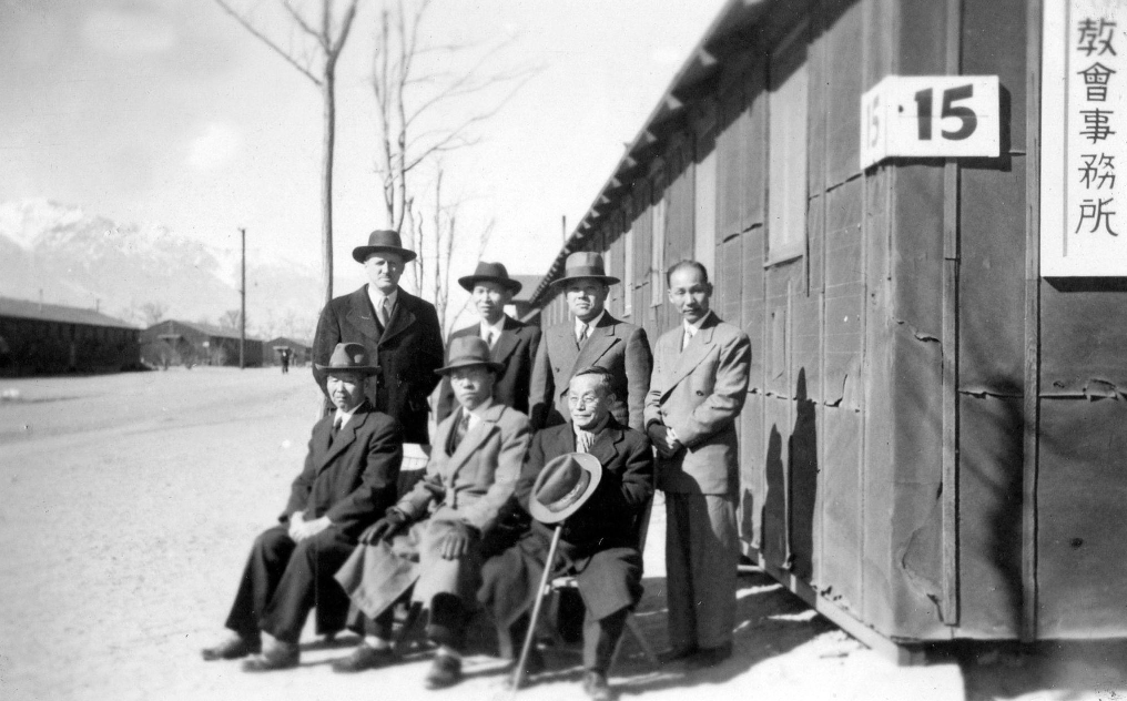 Pastors outside barracks.